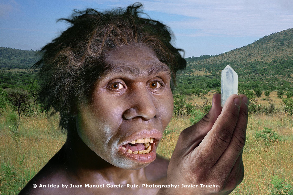 [Hominid studying quartz]