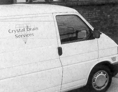 [white van with legend 'Crystal Drain Services']