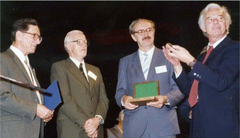 Presentation of the Ewald Prize to John Cowley and Alex Moodie at the Opening Ceremony of the 1987 Perth Congress. Left-right: John Cowley, Alex Moodie, V. I. Simonov, Theo Hahn